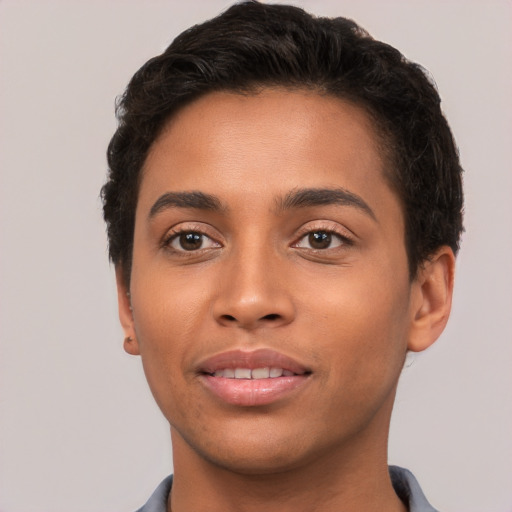 Joyful latino young-adult male with short  brown hair and brown eyes