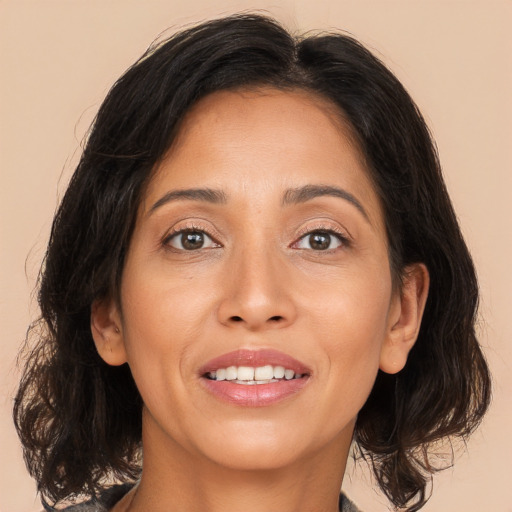 Joyful asian adult female with medium  brown hair and brown eyes