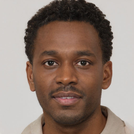 Neutral black young-adult male with short  brown hair and brown eyes