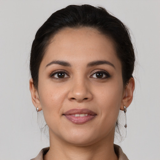 Joyful white young-adult female with medium  brown hair and brown eyes