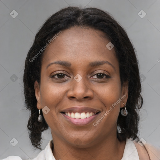 Joyful black young-adult female with medium  brown hair and brown eyes