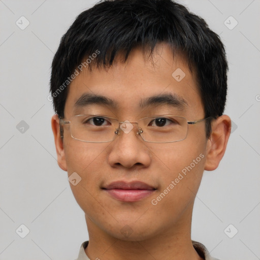 Joyful asian young-adult male with short  brown hair and brown eyes