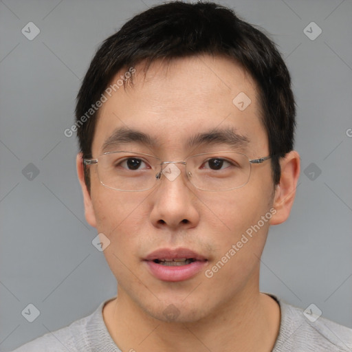 Neutral asian young-adult male with short  brown hair and brown eyes