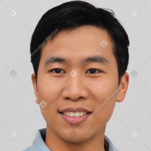 Joyful asian young-adult male with short  black hair and brown eyes