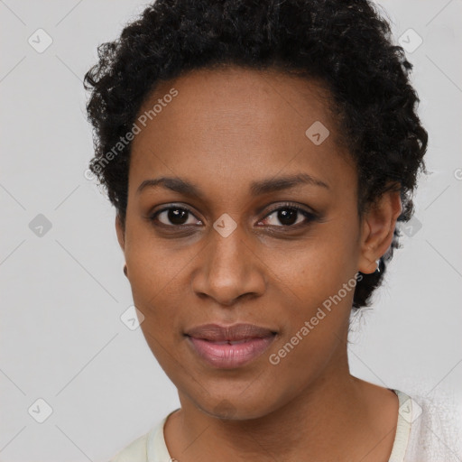 Joyful black young-adult female with short  black hair and brown eyes