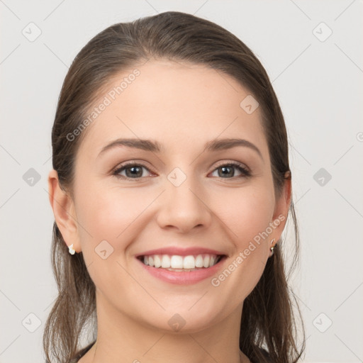 Joyful white young-adult female with long  brown hair and grey eyes