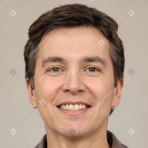 Joyful white adult male with short  brown hair and brown eyes