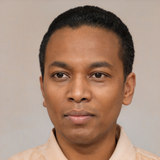 Neutral black young-adult male with short  black hair and brown eyes