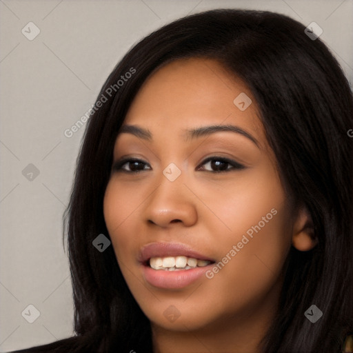 Joyful latino young-adult female with long  black hair and brown eyes