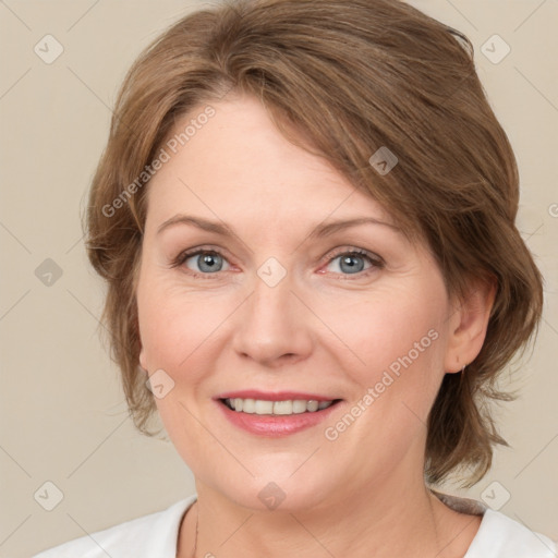 Joyful white adult female with medium  brown hair and green eyes