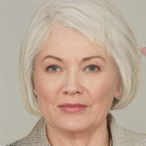 Joyful white adult female with medium  blond hair and blue eyes