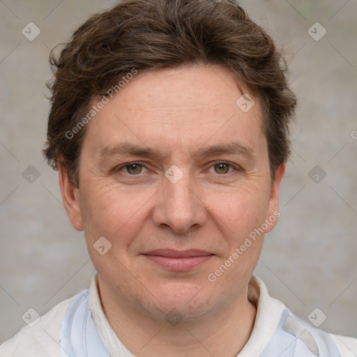 Joyful white adult male with short  brown hair and grey eyes