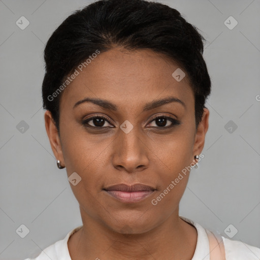 Joyful black young-adult female with short  brown hair and brown eyes