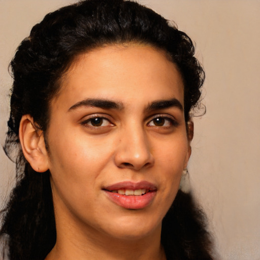 Joyful latino young-adult female with long  brown hair and brown eyes