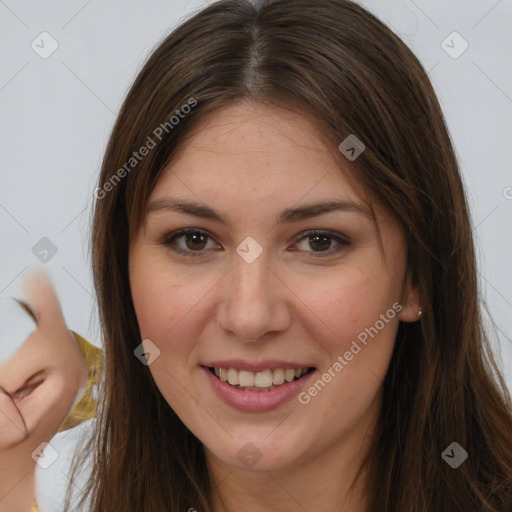 Joyful white young-adult female with long  brown hair and brown eyes