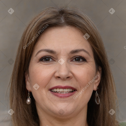 Joyful white adult female with long  brown hair and grey eyes