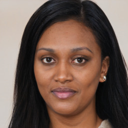 Joyful asian young-adult female with long  brown hair and brown eyes