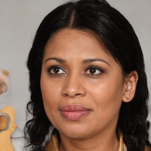 Joyful black young-adult female with medium  brown hair and brown eyes
