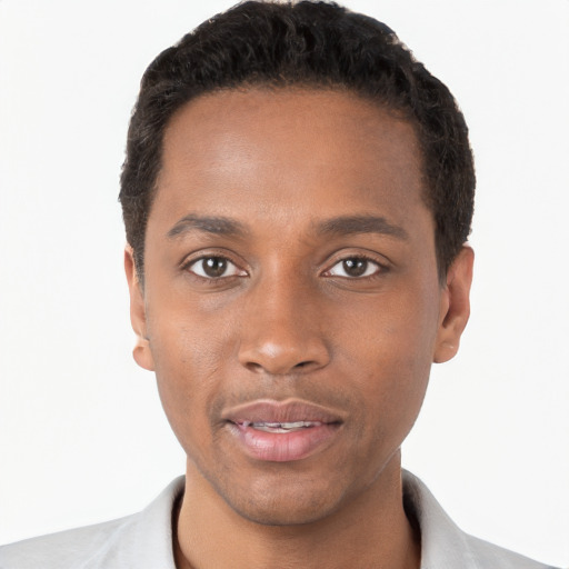 Joyful black young-adult male with short  black hair and brown eyes