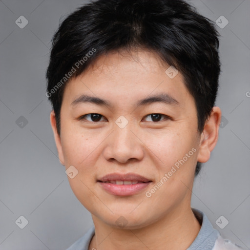 Joyful asian young-adult male with short  brown hair and brown eyes