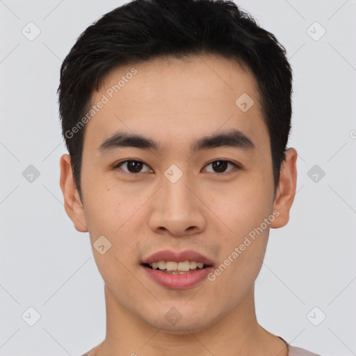 Joyful asian young-adult male with short  brown hair and brown eyes