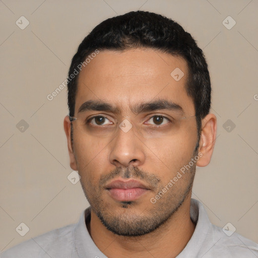 Neutral latino young-adult male with short  black hair and brown eyes