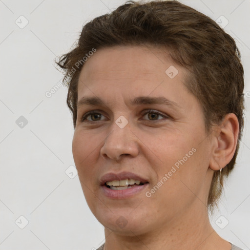 Joyful white adult female with short  brown hair and brown eyes