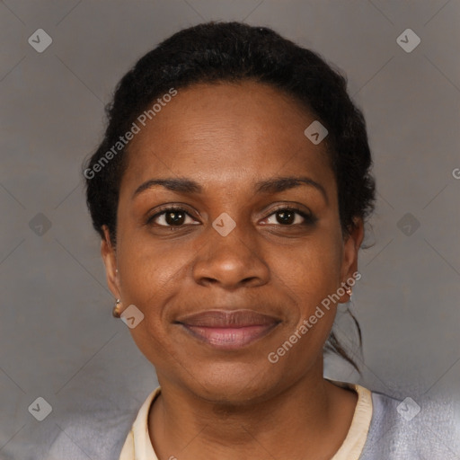 Joyful black adult female with short  black hair and brown eyes