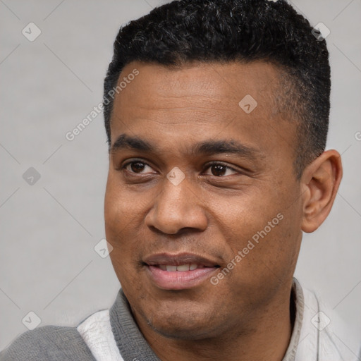 Joyful black adult male with short  black hair and brown eyes