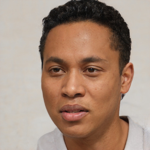 Neutral black young-adult male with short  black hair and brown eyes