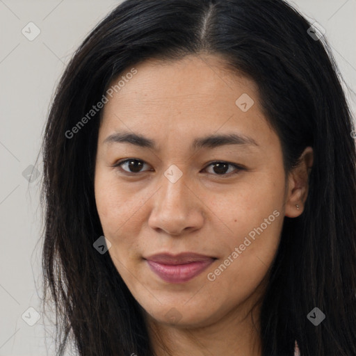 Joyful asian young-adult female with long  brown hair and brown eyes