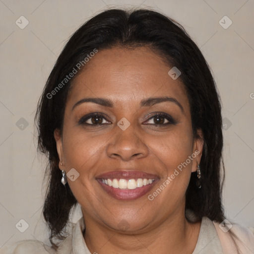 Joyful black adult female with medium  brown hair and brown eyes