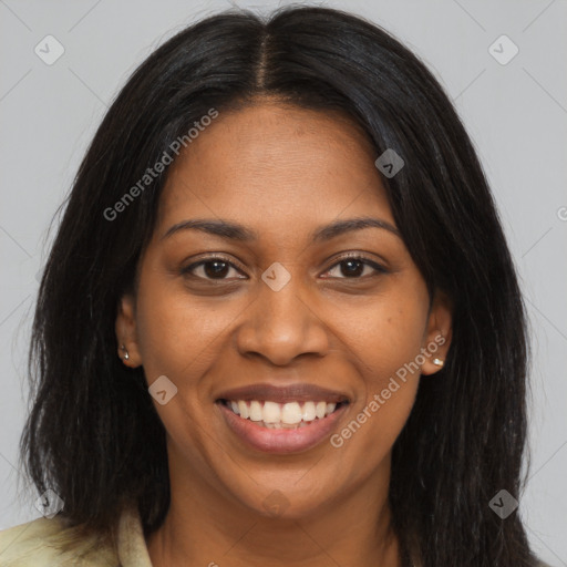 Joyful black young-adult female with long  brown hair and brown eyes