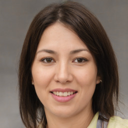 Joyful asian young-adult female with medium  brown hair and brown eyes