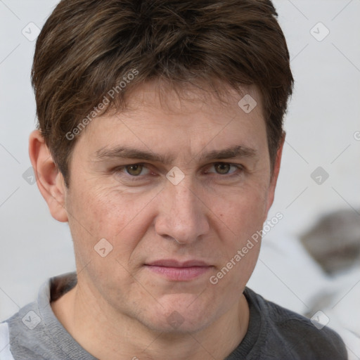 Joyful white adult male with short  brown hair and grey eyes