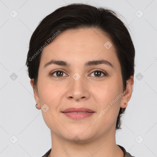 Joyful white young-adult female with medium  brown hair and brown eyes