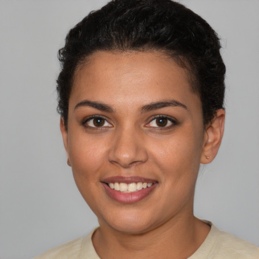 Joyful latino young-adult female with short  brown hair and brown eyes