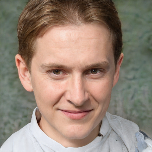 Joyful white adult male with short  brown hair and grey eyes