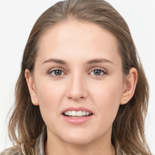 Joyful white young-adult female with long  brown hair and grey eyes