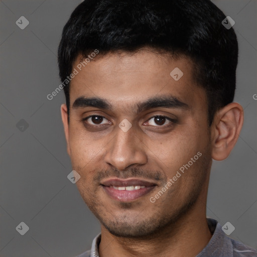 Joyful latino young-adult male with short  brown hair and brown eyes