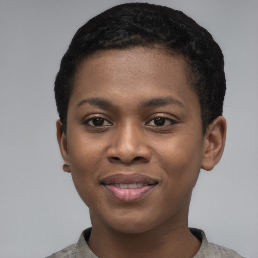 Joyful black young-adult female with short  black hair and brown eyes