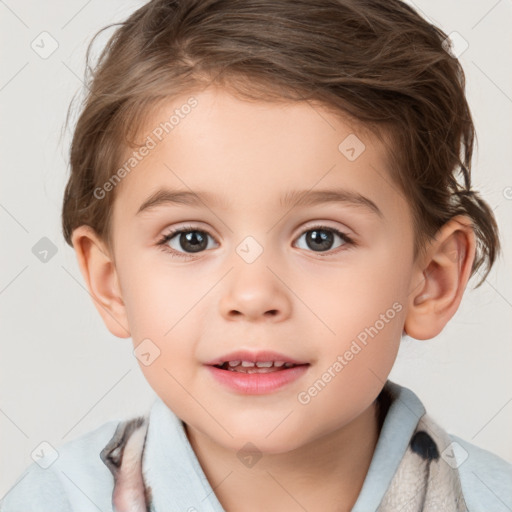 Joyful white child male with short  brown hair and grey eyes