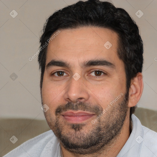 Joyful white young-adult male with short  black hair and brown eyes