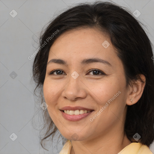 Joyful white adult female with medium  brown hair and brown eyes