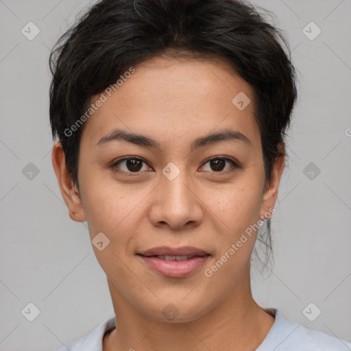 Joyful latino young-adult female with short  brown hair and brown eyes