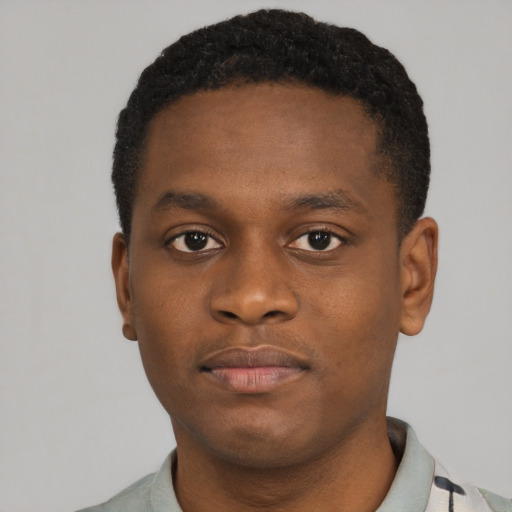 Neutral black young-adult male with short  brown hair and brown eyes