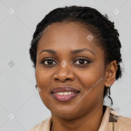 Joyful black young-adult female with medium  black hair and brown eyes