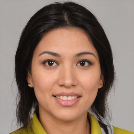 Joyful white young-adult female with medium  brown hair and brown eyes