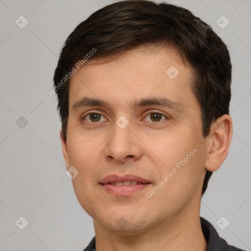 Joyful white young-adult male with short  brown hair and brown eyes