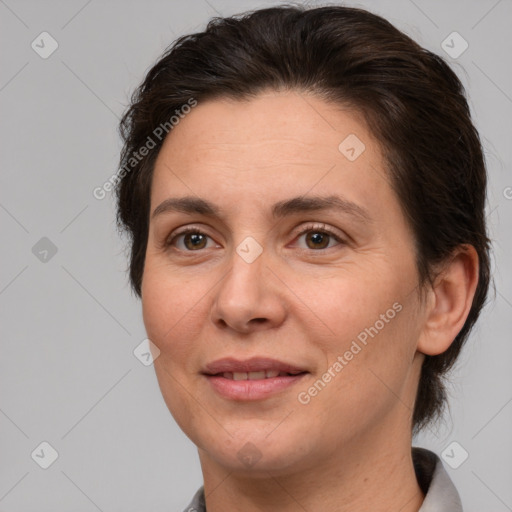 Joyful white adult female with short  brown hair and brown eyes